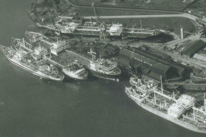 black and white aerial photo of Smith's dock ship repair yard showing a number of ships in the yard 